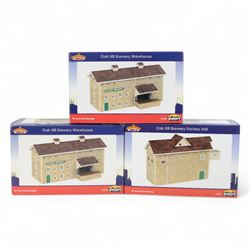 Seven Bachmann Scenecraft 00 gauge 'Oak Hill Brewery' model railway trackside buildings, comprising 44057 Factory Unit, two 44056 Warehouses, two 44058 Hop Drying Kilns, 44059 Boiler House and 44060 Boiler House Chimney, all boxed