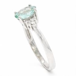 18ct white gold Paraiba tourmaline and diamond ring, single oval cut tourmaline of approx 0.95 carat, with three round brilliant cut diamonds set either side, Birmingham 2008