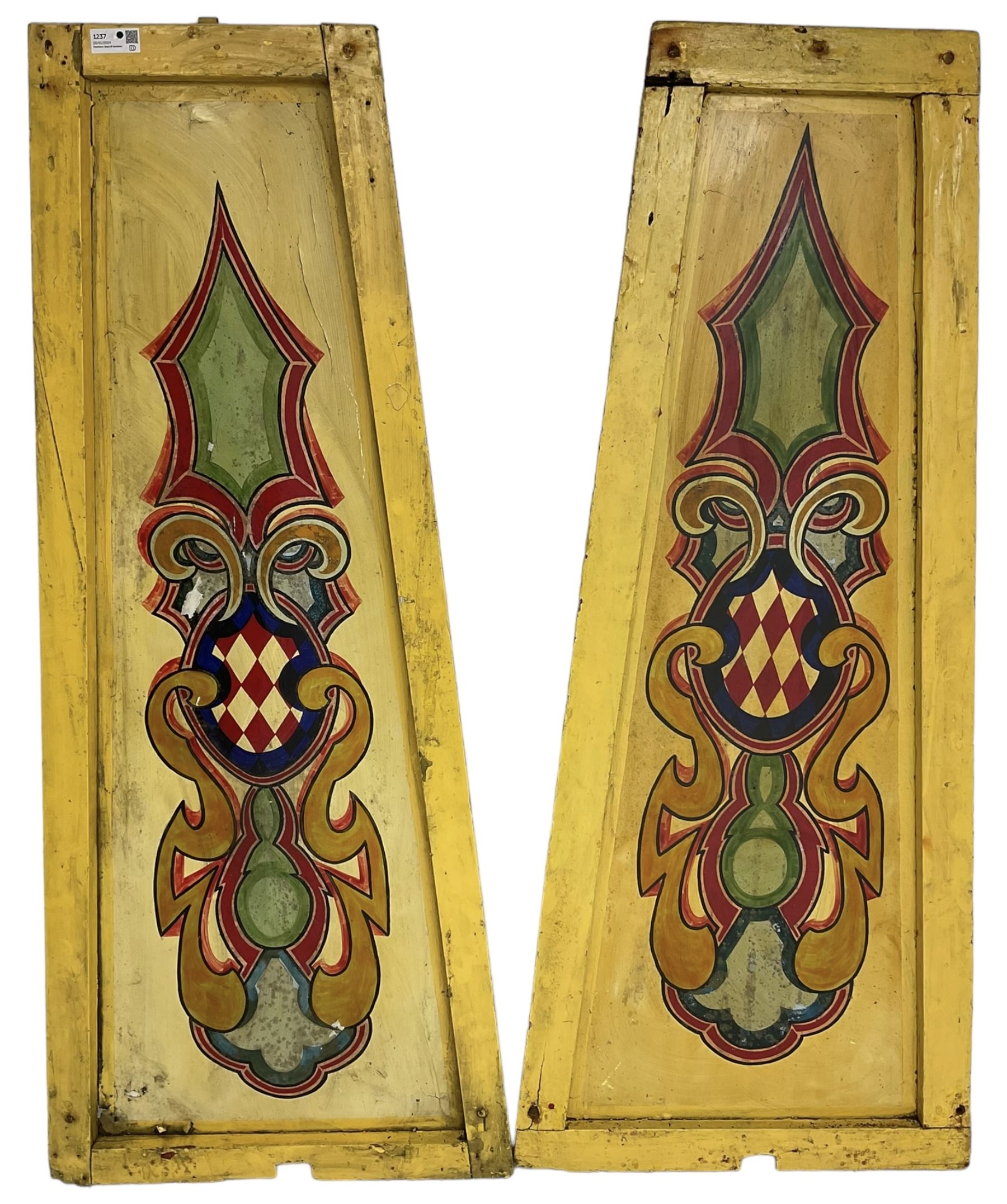 Two early 20th century fairground 'Chair-O-Plane' panels, wooden framed with sheet metal panels, painted in yellow with scrolled cartouche decoration in red, gold and green