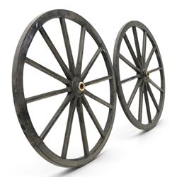 Pair of Victorian black lacquered and painted cartwheels with twelve spokes