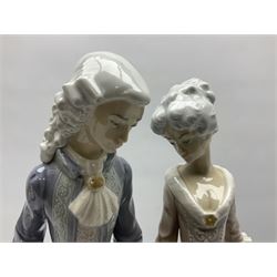 Lladro figure, Walk in Versailles, modelled as a man and woman in period dress, sculpted by Vincente Martinez, no 5004, year issued 1978, year retired 1981, H40cm 