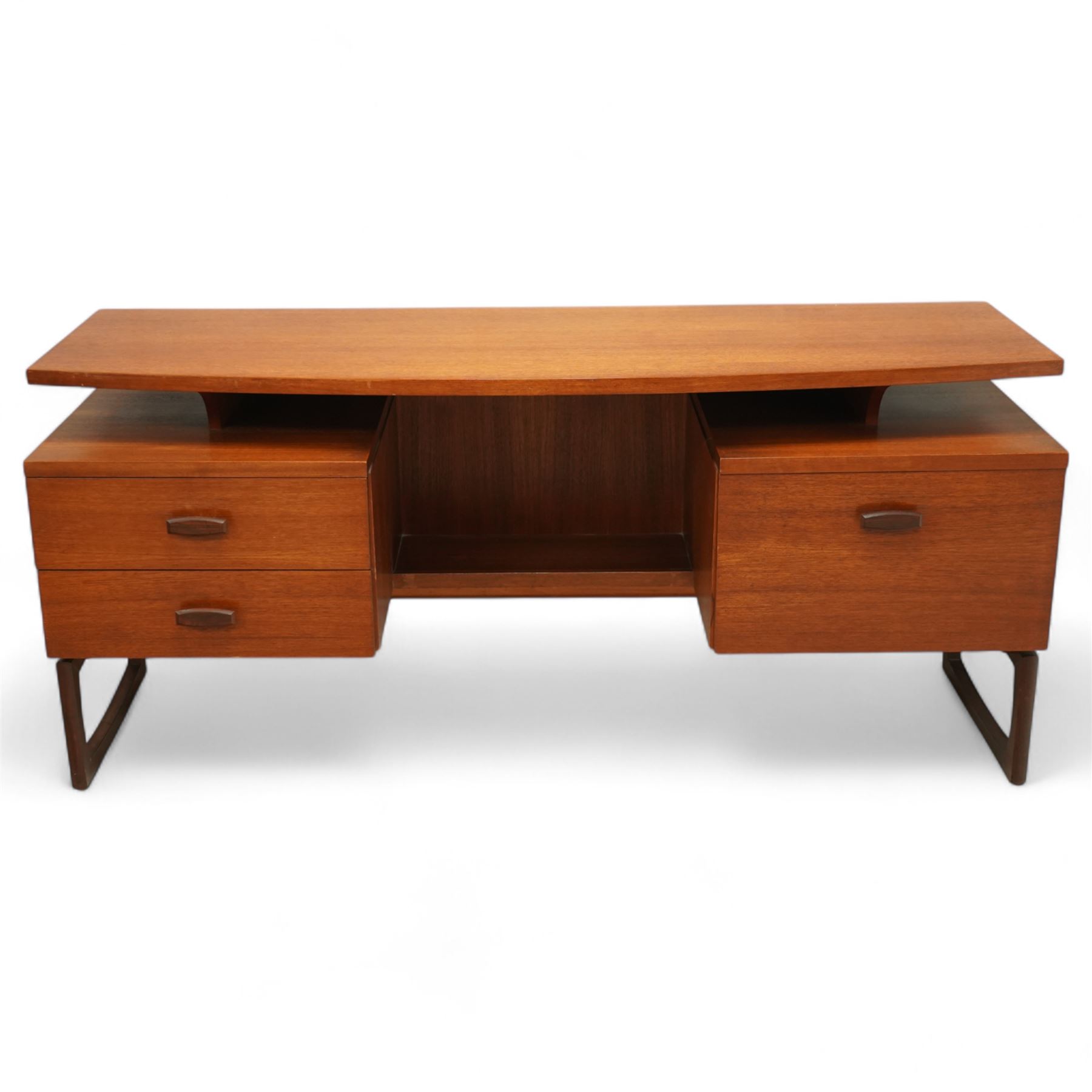 R Bennett for G Plan - mid-20th century teak 'Quadrille' desk or dressing table,  shaped platform rectangular top above rectilinear open base above four drawers with sculpted handles, on rectangular frame supports 
