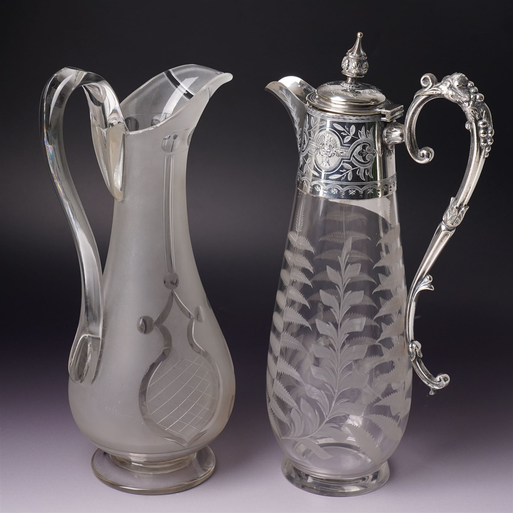 Victorian opaque glass ewer with clear cut decoration and clear glass handle H28cm and an etched glass claret jug with silver plated cover and handle H31cm