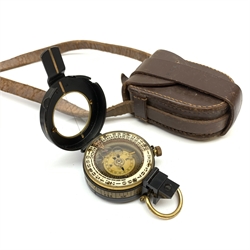 Military style marching compass, unmarked but inscribed H.E.B for Harold Ellett-Brown., in leather carrying case; and leather cased pair of similarly initialled hair brushes (2)