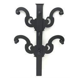 Victorian black painted mahogany coat stand, four shaped supports with seven pegs, H131cm, W89cm