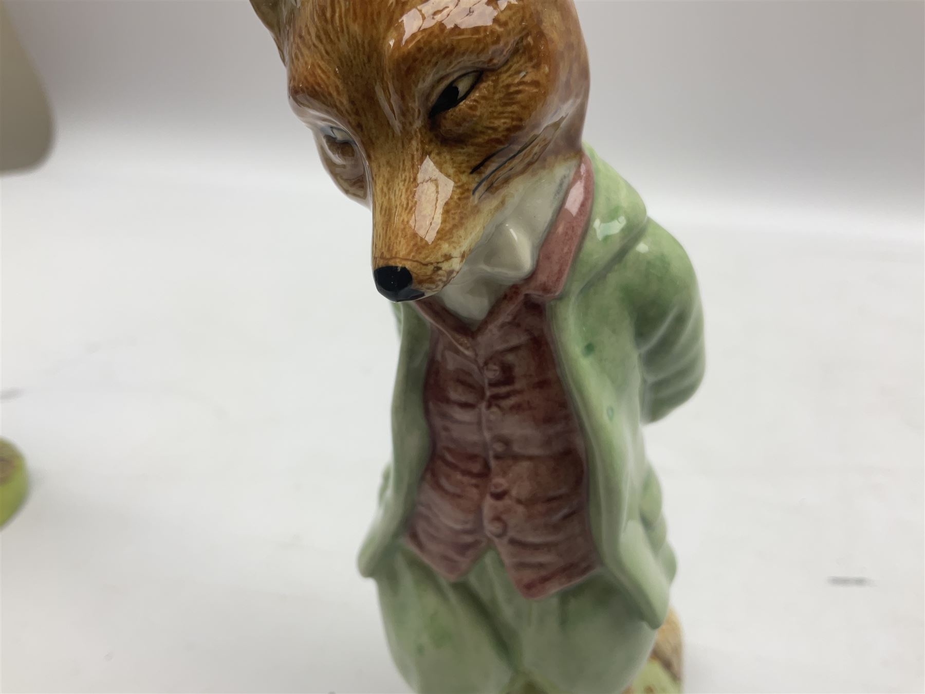 Two Royal Doulton Brambly Hedge figures comprising ‘Mrs Saltapple’ and ‘Poppy Eyebright’, Royal Albert Beatrix Potter ‘Foxy Whiskered Gentleman’ and ‘Mr Benjamin Bunny’, all with boxes, two Border Fine Arts Beatrix Potter figures comprising ‘Mrs Tiggywingle’ and ‘Mrs Rabbit’, Royal Doulton ‘Spike and Tyke’ and ‘Winnie Pooh and Footprints’ both with boxes, all marked beneath