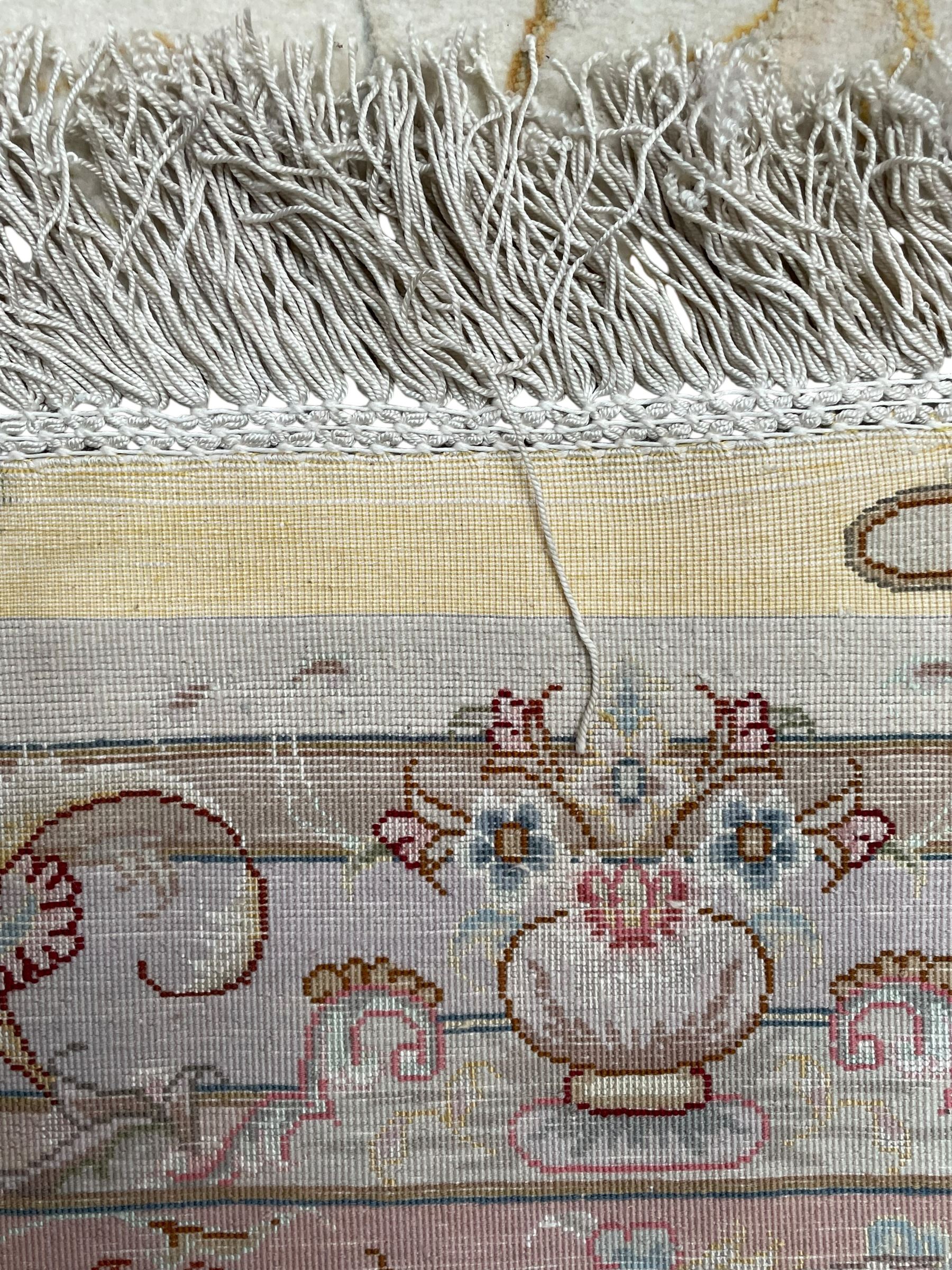 Persian Mahal densely knotted ivory ground carpet, floral rosette medallion surrounded by interlacing leafy branches and palmettes, scrolling border decorated with foliate motifs, within guard stripes, with signature panels to each end