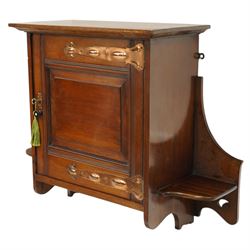 Small Arts & Crafts mahogany wall cupboard, single panelled door enclosing shelf, flanked by two shelves with pierced brackets, with shaped copper fittings and escutcheon 