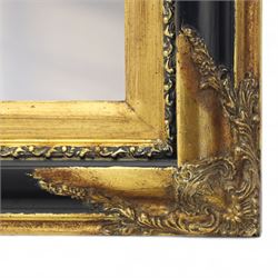 19th century design rectangular wall mirror, set within a swept giltwood and gesso frame, with foliate corner mounts and ebonised inner border, enclosing a bevelled mirror plate