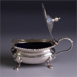 Silver cruets, including pair of open salts, mustard pot and cover, two silver pepper shakers and a collection of spoons, all hallmarked