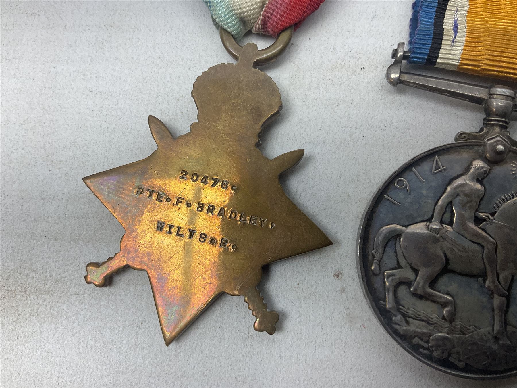 WW1 group of three medals comprising British War Medal, 1914-15 Star and Victory Medal awarded to 20478 Pte. F. Bradley Wilts. R.; all with ribbons; some biographical details