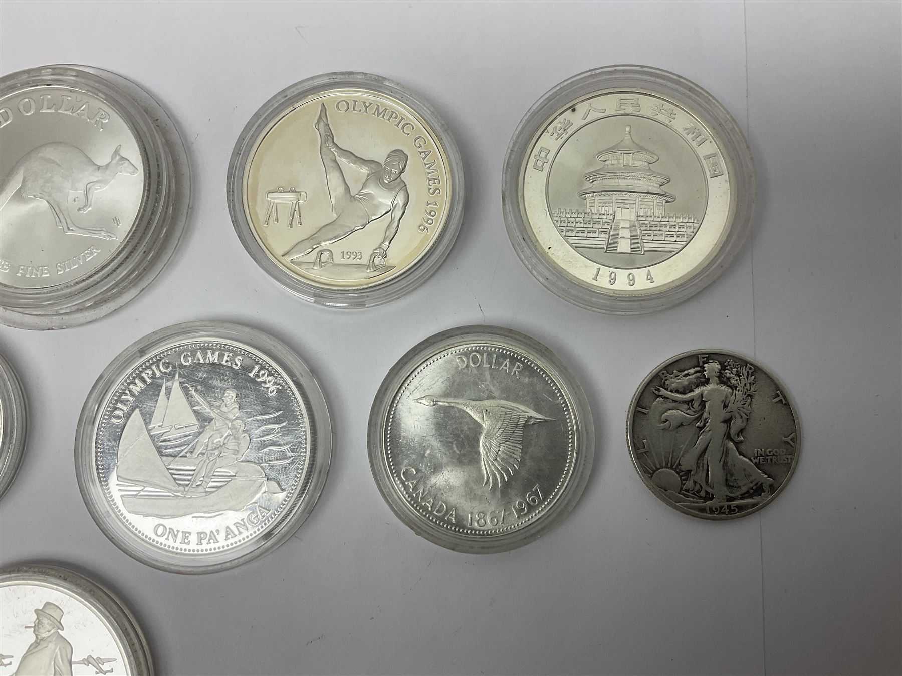 United States of America 1896 Morgan one dollar coin, 1893 'Columbian Exposition' commemorative half dollar, 1945 standing Liberty half dollar, Queen Elizabeth II Australia 1993 one ounce fine silver dollar, Canada 1967 and 1995 one dollar coins etc (15)