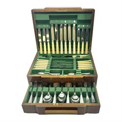Art Deco canteen of silver plated cutlery for twelve place settings, including table and dessert knives with ivorine handles, retailed by Harrods Ltd, contained within a wooden case, with drawer to base, canteen case H15.5cm