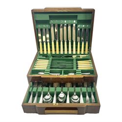  Art Deco canteen of silver plated cutlery for twelve place settings, including table and dessert knives with ivorine handles, retailed by Harrods Ltd, contained within a wooden case, with drawer to base, canteen case H15.5cm