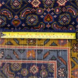 North West Persian Bidjar hand-knotted runner, decorated with an all-over herati pattern on a deep indigo ground, the field is filled with a repeating diamond and rosette motifs, interspersed with stylized leaves and floral elements, framed by a border on an ochre ground flanked by contrasting guard borders, with cotton fringe ends 