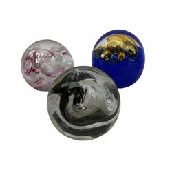 Svaja glass paperweight, together six other paperweights, including four Caithness examples. 