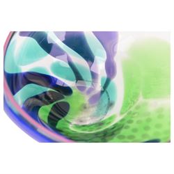 Jane Charles (British Contemporary): freeform studio glass bowl, with green, blue and purple flowing decoration, upon a textured circular foot, H16.5cm, D30cm
