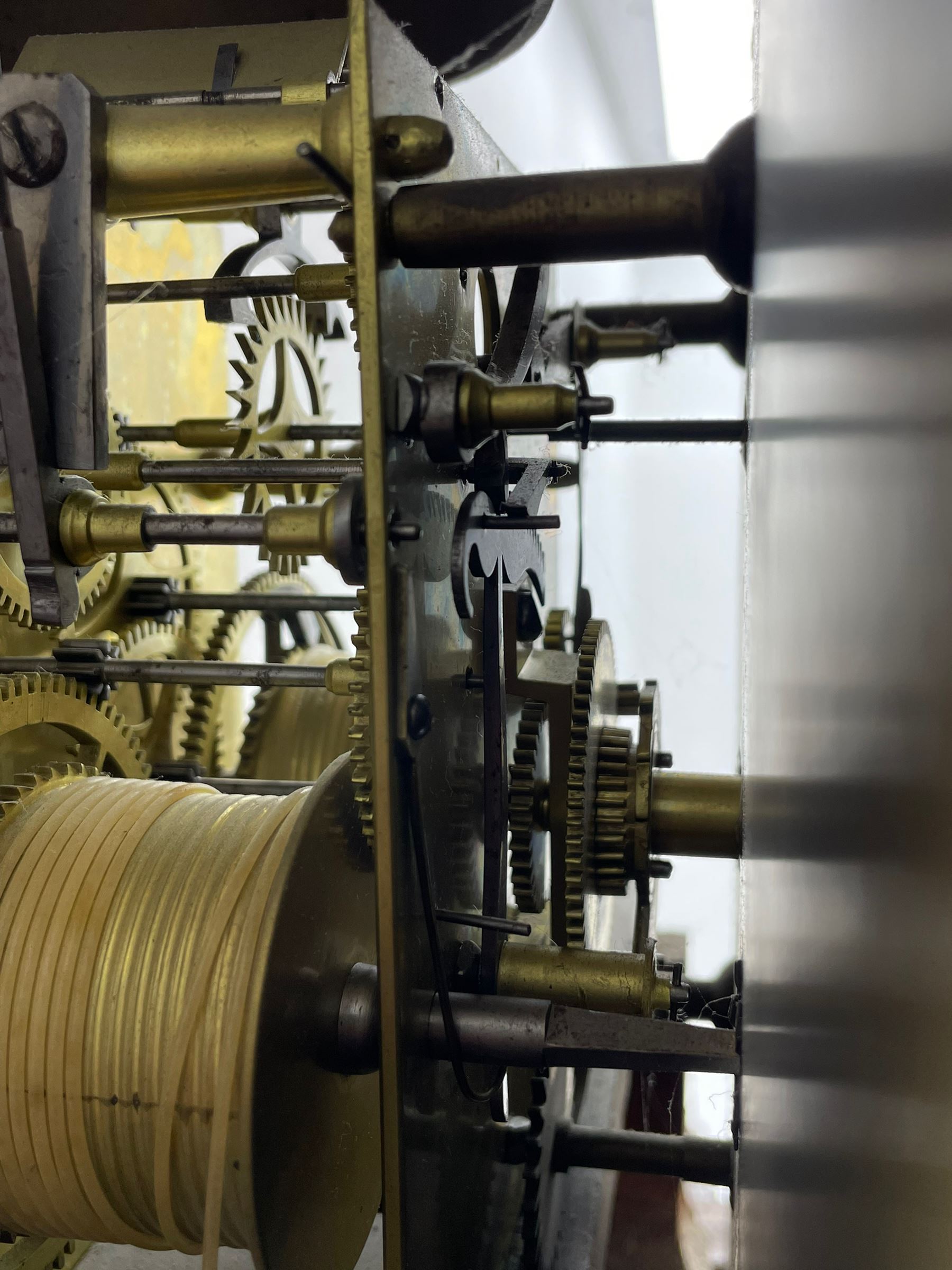 Samuel Ritchie of Forfar - William IV 8-day Scottish longcase clock in a mahogany case, with a swans neck pediment, brass paterae and three ball and spire brass finials, case and trunk inlaid with satinwood stringing on a plinth raised on decorative bracket feet, painted break arch dial depicting a costal scene to the break arch and conch seashells to the spandrels, Roman numerals, subsidiary seconds and date dials with matching steel hands, with a rack striking movement striking the hours on a bell. With weights, key, and pendulum.  Samuel Ritchie is recorded as working in Forfar 1800-37.