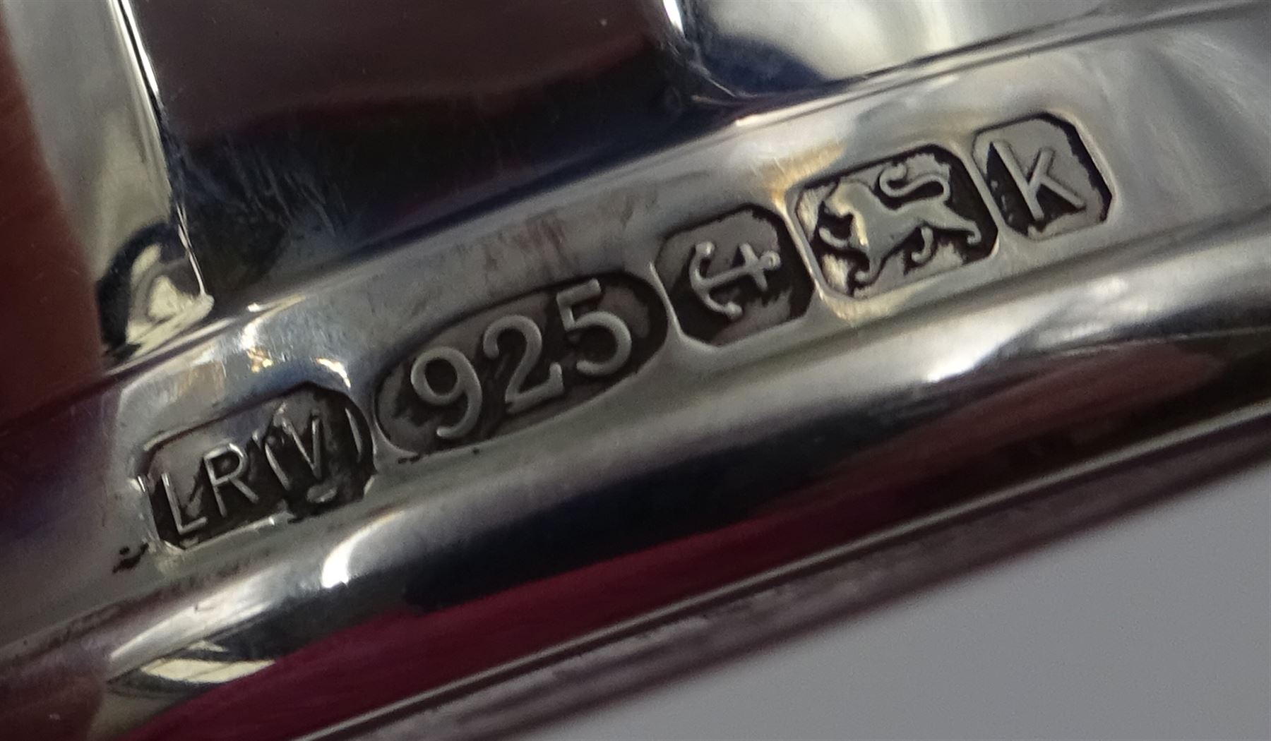 Pair of modern silver salt and pepper shakers, of tapering faceted form, hallmarked Laurence R Watson & Co, Birmingham 2009, H7cm, boxed 