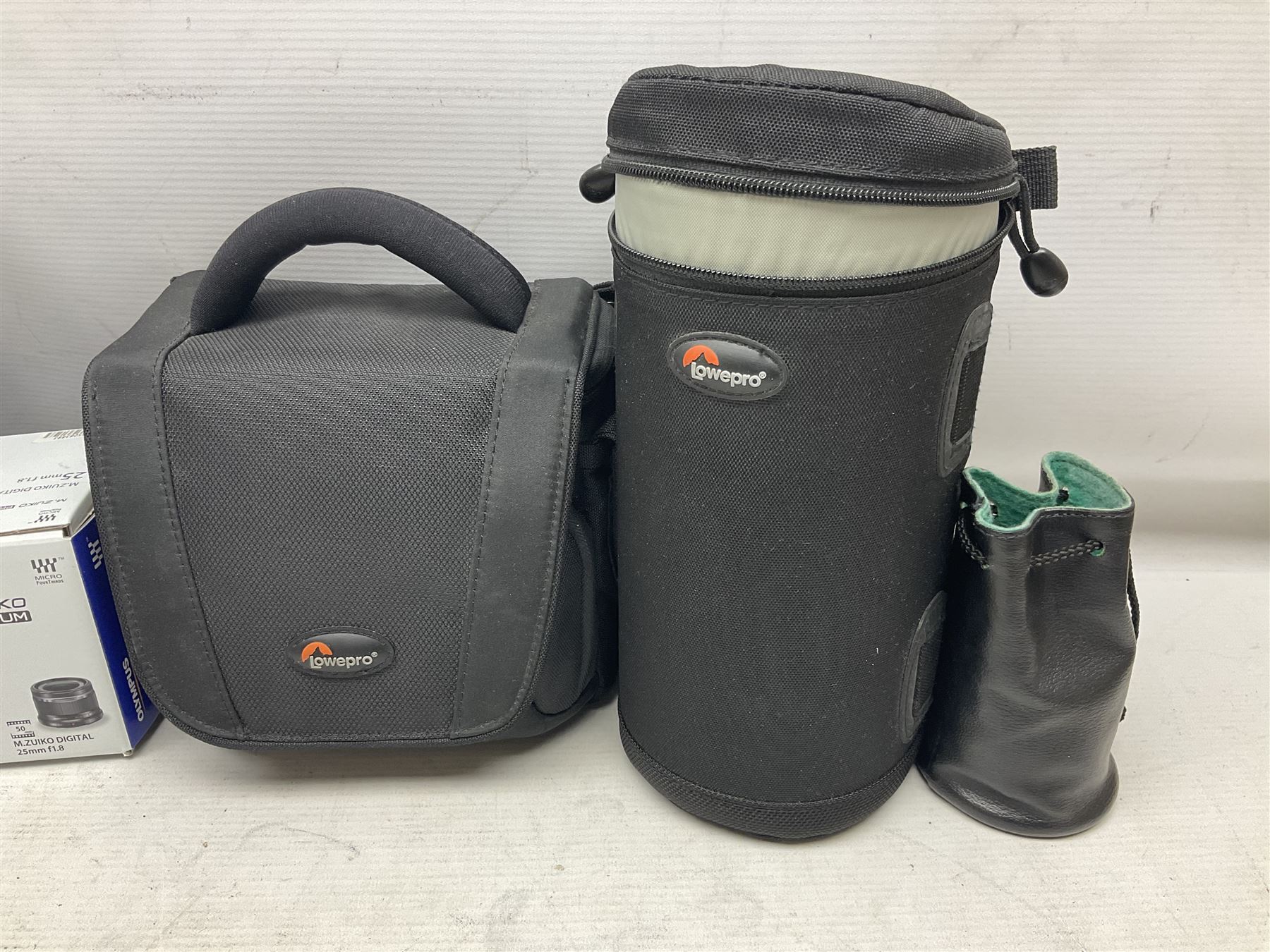 Olympus PEN-F camera body, with 'Olympus M- Zuiko Digital 25mm 1: 1.8' lens,  'Olympus M- Zuiko Digital 75-300mm 1: 4.8 - 6.7' lens and  'Olympus M- Zuiko Digital 17mm 1: 1.8' lens, with original box, together with Lowepro camera bag