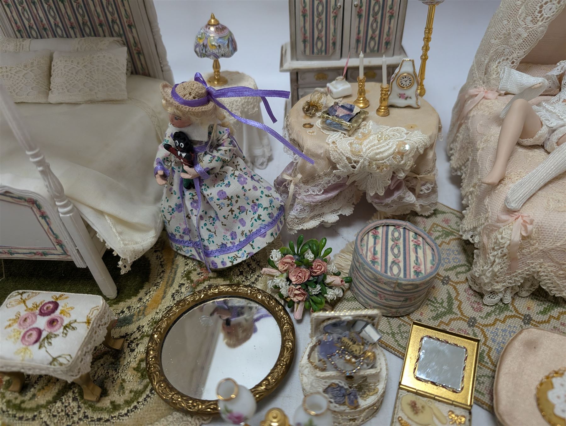 Dolls house bedroom and dressing room furniture, including beds, wardrobe, dressing table, lamps, tables, two figures and a collection of accessories