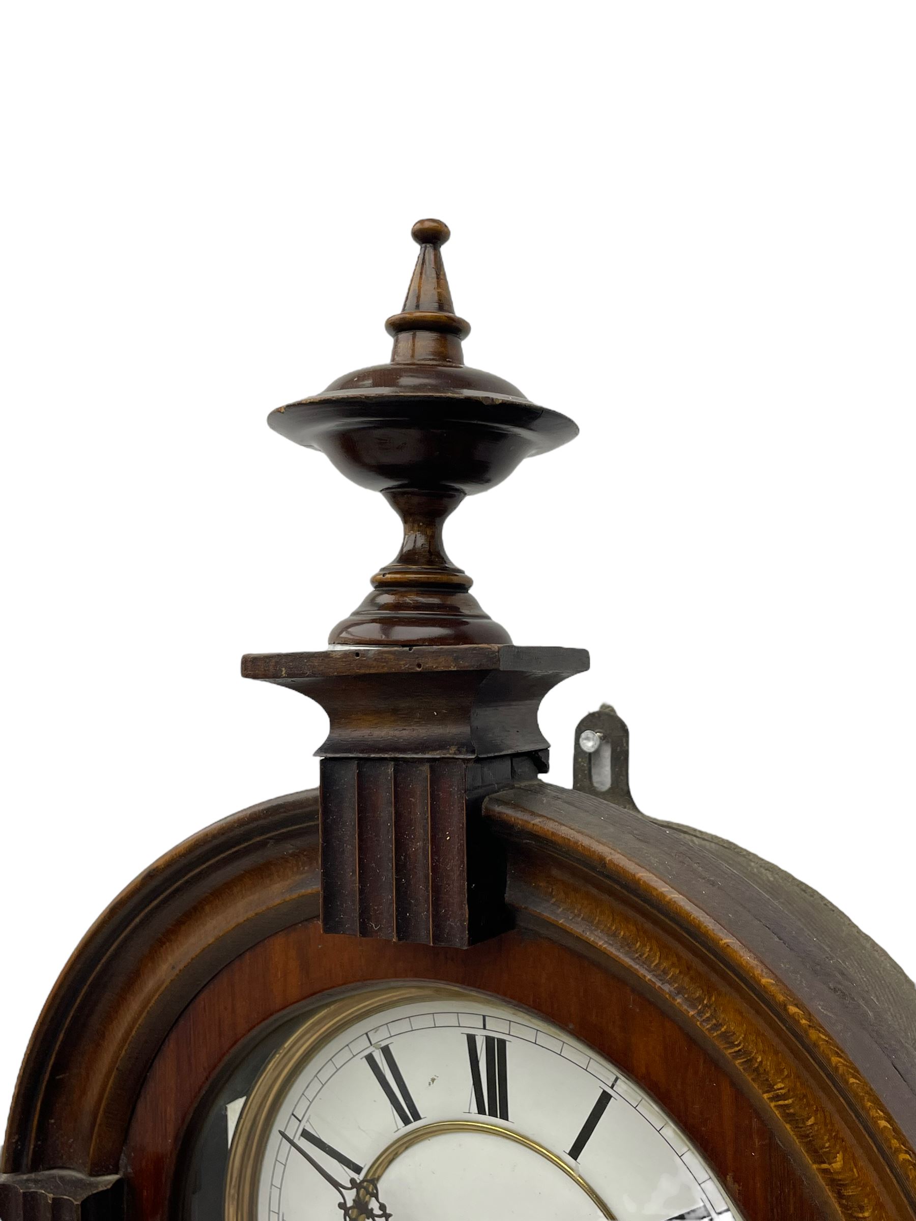 Lenzkirch – 8-day walnut cased weight driven Vienna regulator manufactured 1877-1878, with a break-arch pediment surmounted by a turned finial on a raised cavetto molding, fully glazed arched  door flanked by long ring turned pendants, flat base with open fretwork and two short pendants,  two piece enamel dial within a brass slip, Roman numerals, minute track and pierced steel hands, wooden pendulum with a brass faced bob, two brass cased weights and pulleys, dead beat escapement with a rack striking movement sounding the hours and half hours on a coiled gong, movement serial number 421410. 
Lenzkirch were one of Germanys most highly respected clock manufacturers of the 19th century, founded in the late 1850s the company produced movements and cases of high quality up until 1932.
