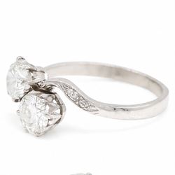 Platinum diamond crossover ring, set with two round brilliant cut diamonds and diamond set shoulders, Birmingham assay mark, total diamond weight approx 1.45 carat