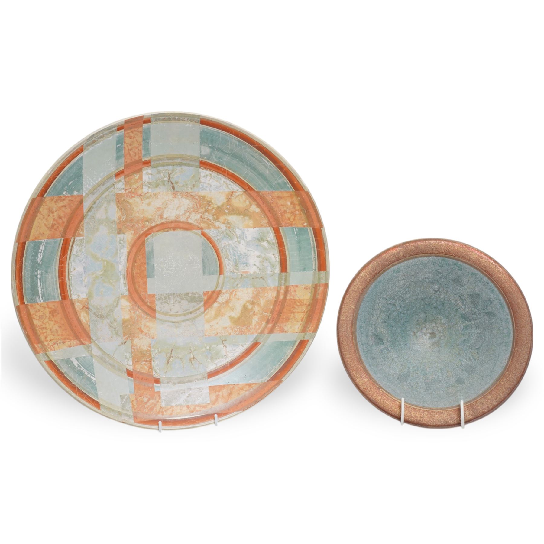 Tony Laverick (1961-); Charger painted with crossing horizontal and vertical lines of marbled blue and orange, the base signed with initials and dated '98, D42.5cm and a smaller bowl, signed with initials and dated '99, D26cm (2)