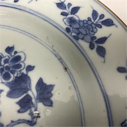 Japanese Meiji period Arita blue and white plate, of circular form, painted with riverside landscape and bird upon flowering branch, with character mark beneath, D24.5cm, together with two 18th century Chinese blue and white plates, each painted with floral design, each approximately D22.5cm