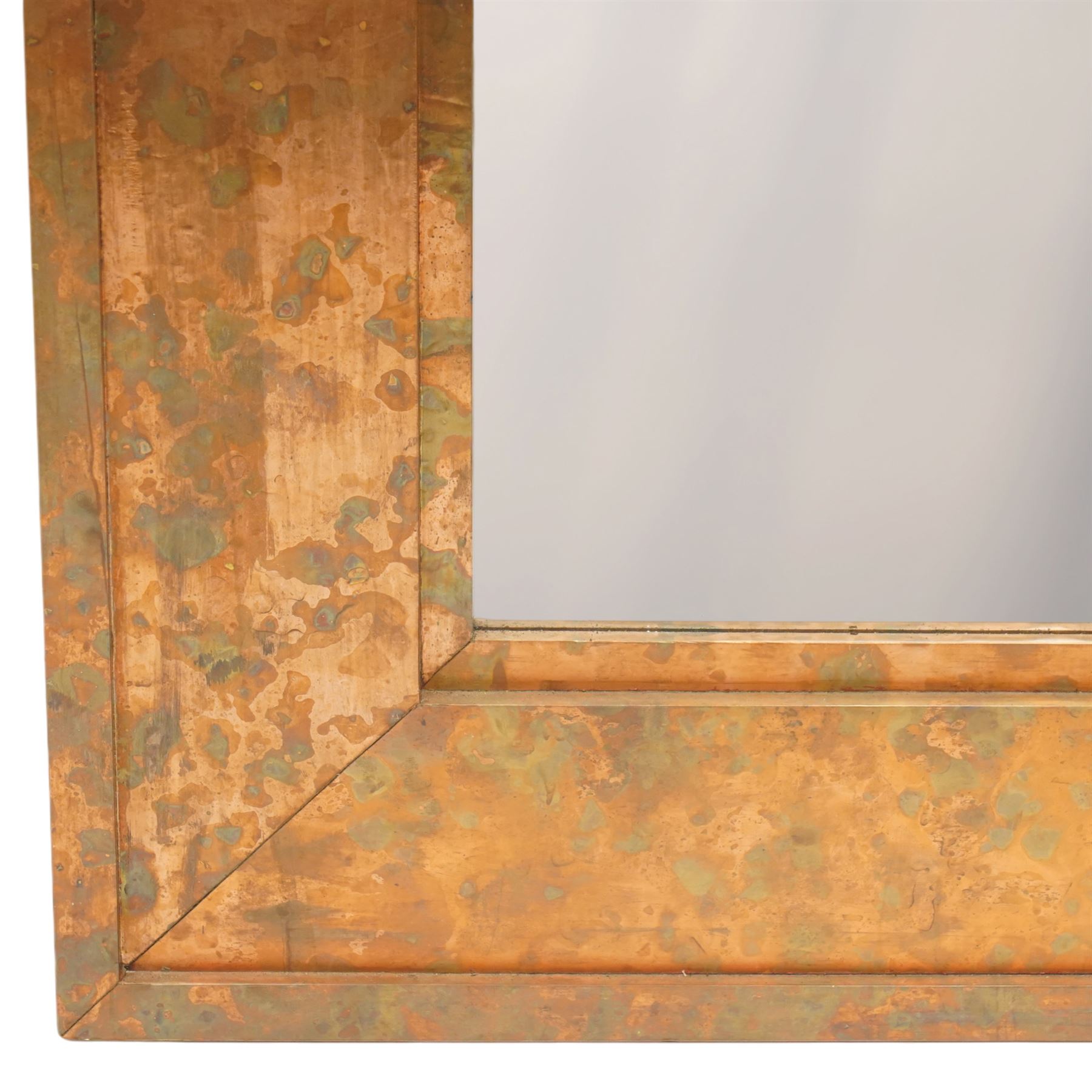 Large contemporary distressed copper effect framed wall mirror, stepped frame enclosing a bevelled mirror plate