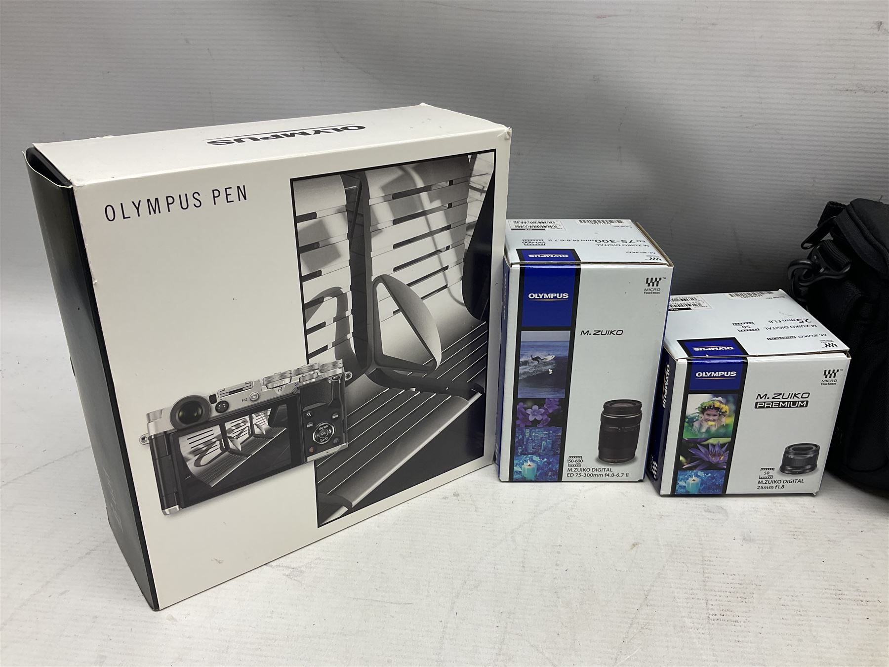 Olympus PEN-F camera body, with 'Olympus M- Zuiko Digital 25mm 1: 1.8' lens,  'Olympus M- Zuiko Digital 75-300mm 1: 4.8 - 6.7' lens and  'Olympus M- Zuiko Digital 17mm 1: 1.8' lens, with original box, together with Lowepro camera bag