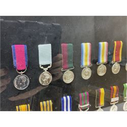 Limited edition large framed display board with sixty half-size copies of British Gallantry and Campaign Medals produced by Danbury Mint; all with ribbons and associated booklet