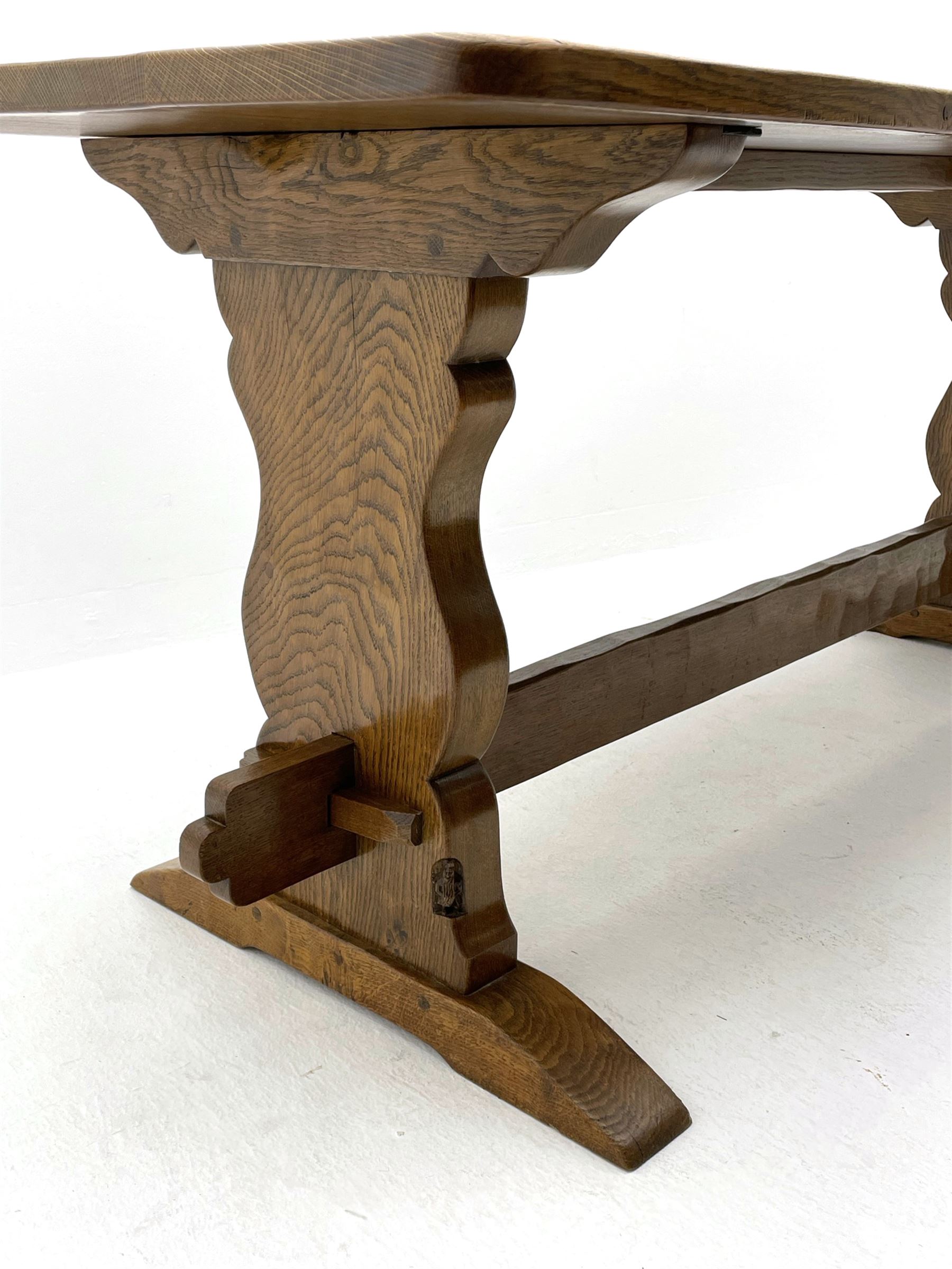 ‘Gnomeman’ oak dining table, rectangular adzed top, shaped end supports on sledge feet joined by pegged stretcher, carved with gnome signature, by Thomas Whittaker of Littlebeck