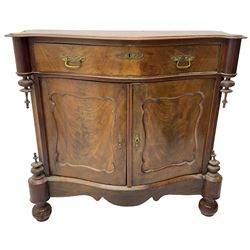 Victorian mahogany serpentine side cabinet, fitted with single drawer over panelled cupboard enclosing single shelf, raised on turned bun feet