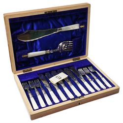 Cased set of six mother of pearl handled fish knives and forks with servers, small 19th century table writing slope,, two glass decanters etc