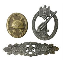 Three WW2 German badges - Close Combat Clasp; Army Flak badge; and Wound badge