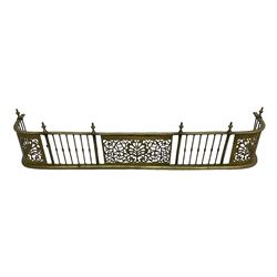 Early 19th century Irish brass D-shaped brass fender, twist borders and balustrade supports, central pierced frieze panel decorated with scrolling foliage and central anthemion motif  