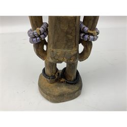 Early 20th century West African Yoruba family wooden figure of Orisha Oko, the god of farming/agriculture, carved from the solid, bears manuscript label of provenance verso H26.5cm