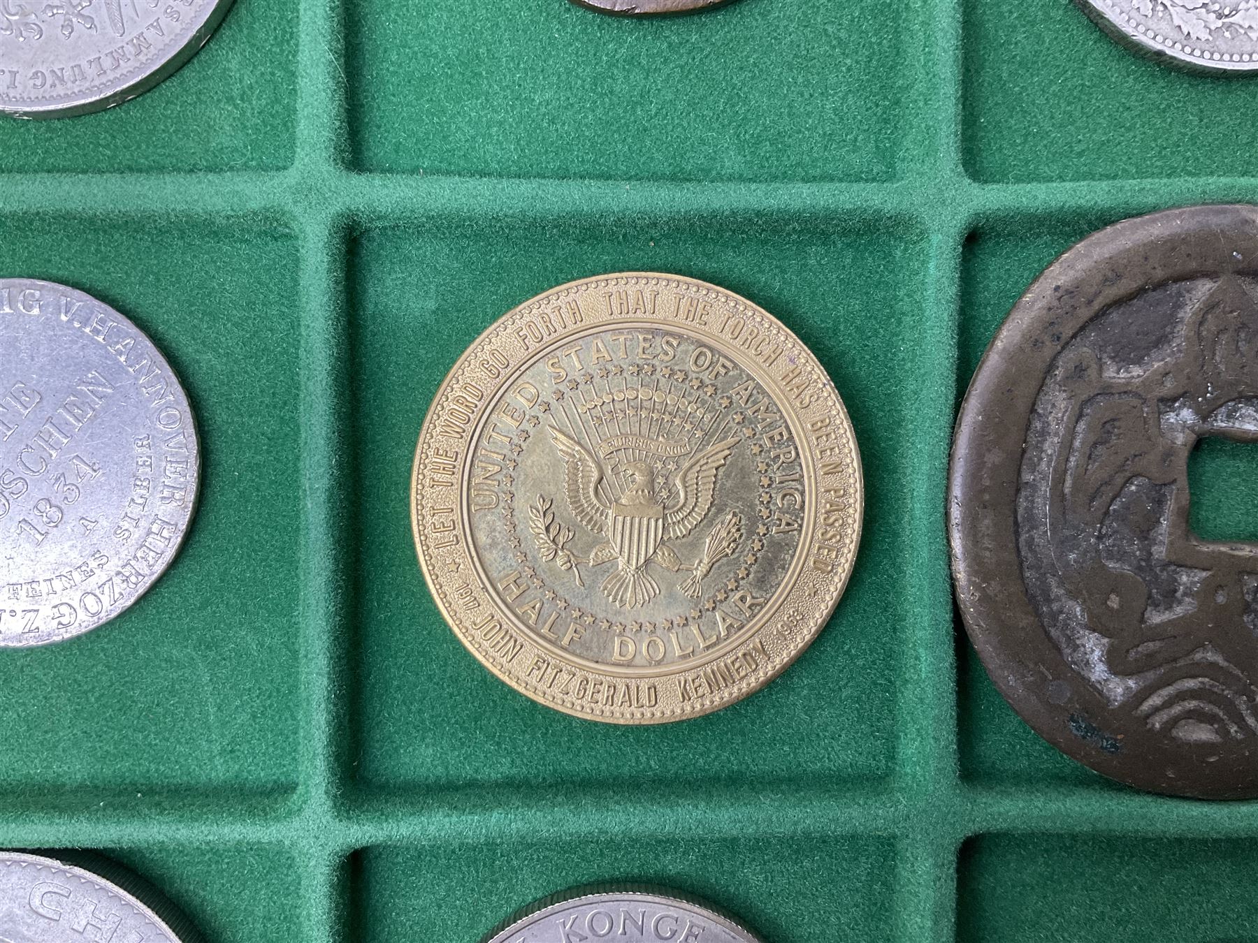 Coins and medallions including, York 1811 one shilling cattle and barber silver token, United States of America 1883O silver Morgan dollar, birds of destiny medal by Malcolm Appleby, Great British King George V 1930 halfcrown, King Edward VII 1902 silver medal, King George V 1916 halfcrown etc, housed in a case with lift out green coin trays