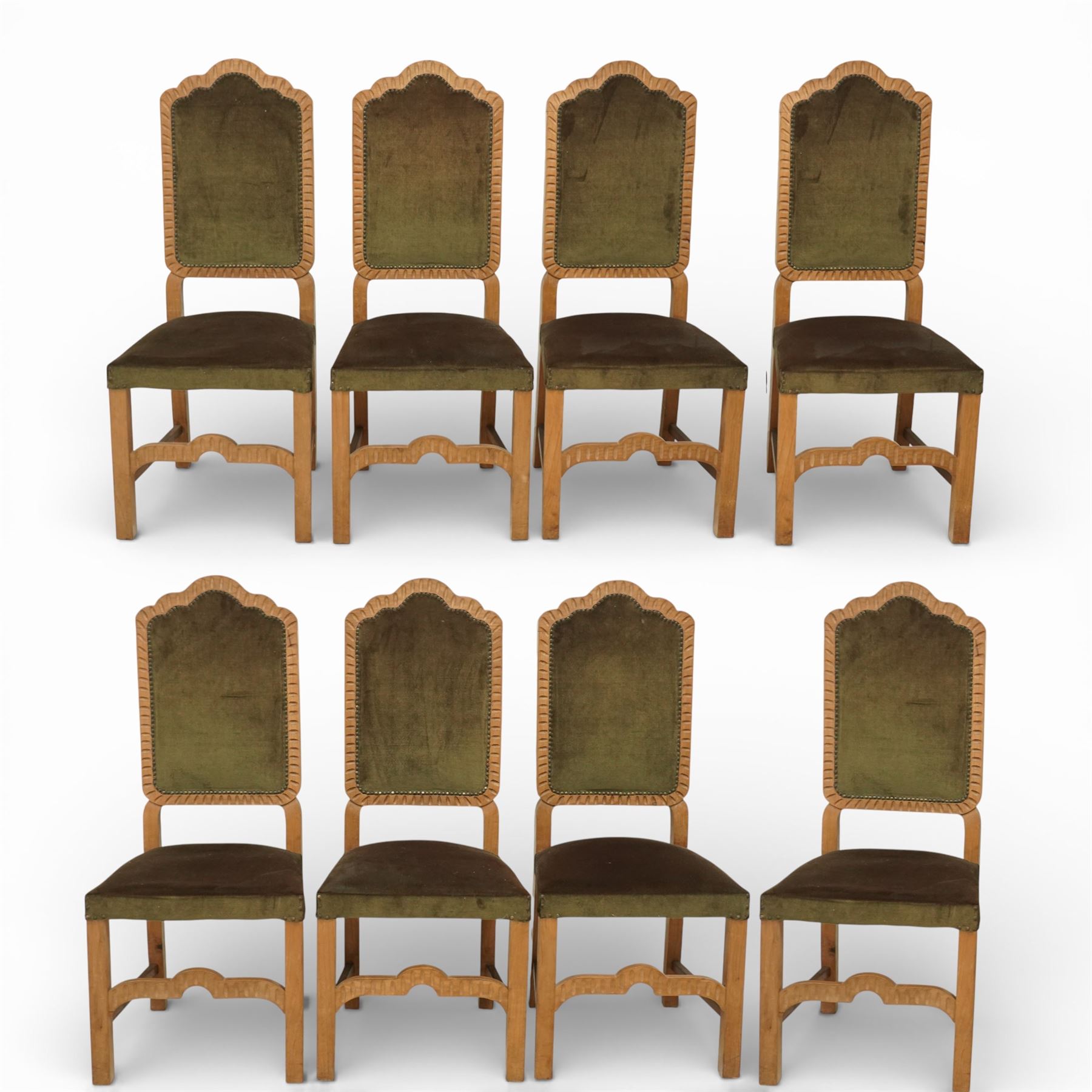 20th century set of eight dining chairs, high back form with shaped and scalloped back rails enclosing upholstered panels, matching upholstered seats, on square legs with shaped apron stretchers