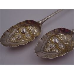 George IV silver fruit serving spoon, the bowl embossed with fruits, with engraved vine leaf decoration to handle, hallmarked London 1789, together with a very similar earlier example, hallmarks worn and indistinct