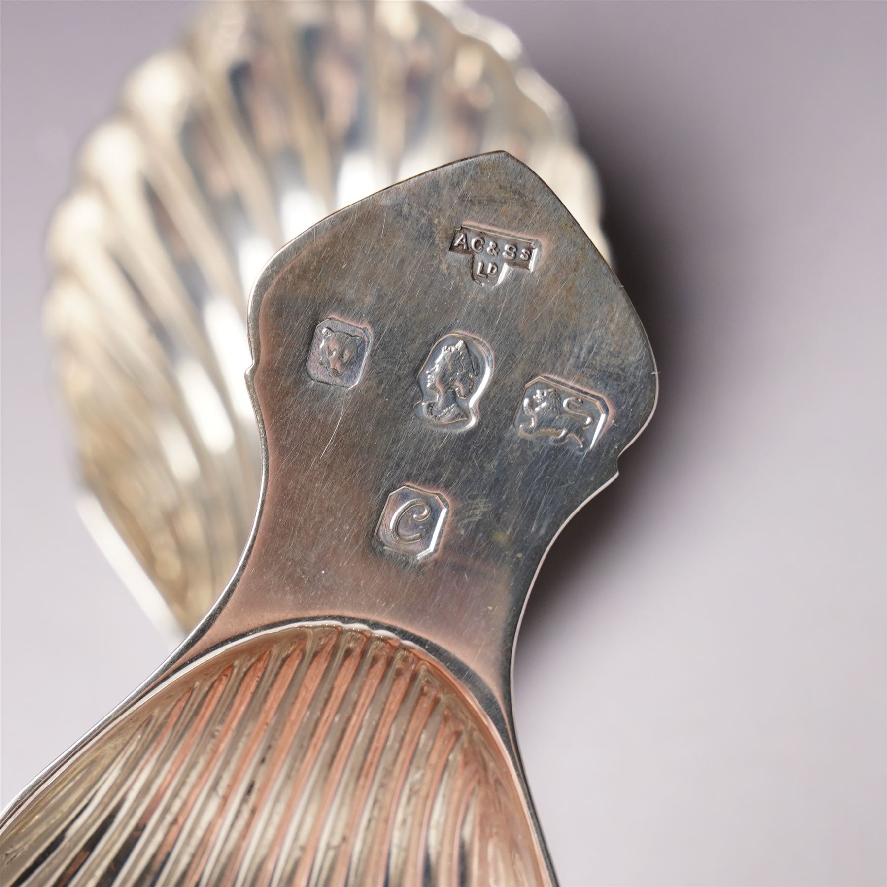 Pair of silver caddy spoons with shell shape bowls and flattened handles London 1977 Maker A Chick & Sons Ltd and a Victorian silver fiddle and thread pattern caddy spoon London 1866 Maker Chawner & Co  
