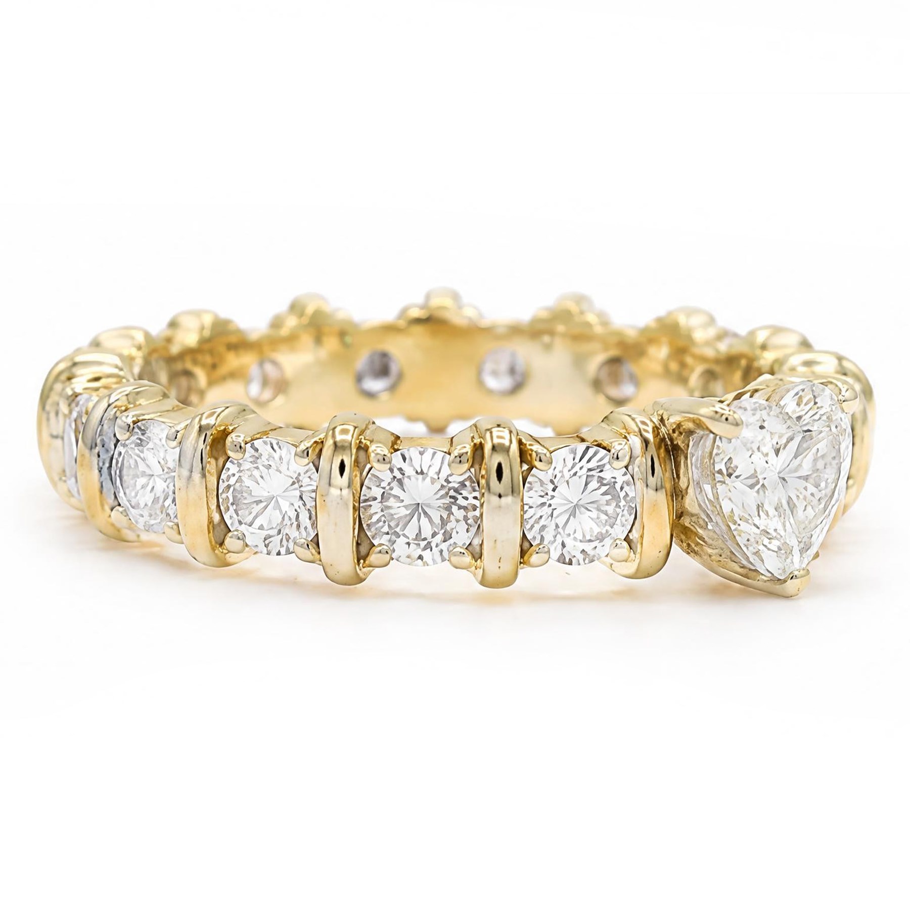 18ct gold diamond eternity ring, set with a single heart cut diamond of approx 0.50 carat and sixteen round brilliant cut diamonds, total diamond weight approx 1.95 carat