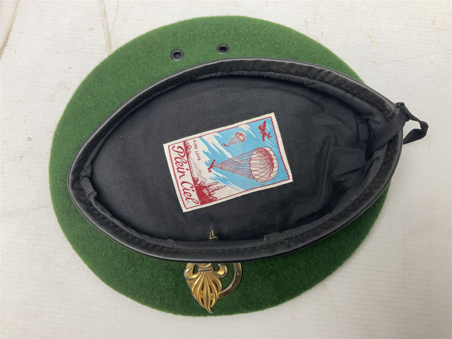 Four paratrooper berets - Russian, Italian, British and Foreign Legion; all with badges (4)
