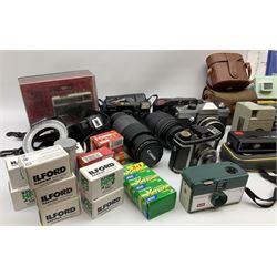 Vintage and later cameras, lenses, accessories and darkroom equipment including Zenit 12XP camera, Praktica BX20 camera fitted with 'Sigma Zoom Master 1:3.5-4.5 f=35-70mm' lens, Praktica LLC camera fitted with 'Carl Zeiss Jena Pancolar 1.8/50' lens, Canon Zoom Lens 'EF 100-300mm 1:5.6', various Jessop and other makers darkroom items including safelight (Red), universal duo tank, multi-mask enlarging easel etc, in three boxes