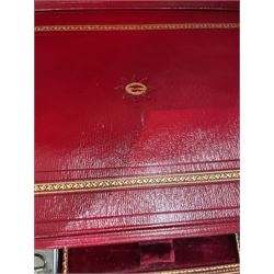  Victorian brass inlaid rosewood dressing table box, retailed by F.L. Hausburg, Liverpool, the lid centred by a brass cartouche, opening to reveal letter store to lid underside, above a fitted interior, with ten mounted cut glass jars, bottles and manicure set, within lift out leather trays, above jewellery drawer, with key, H17cm D24cm