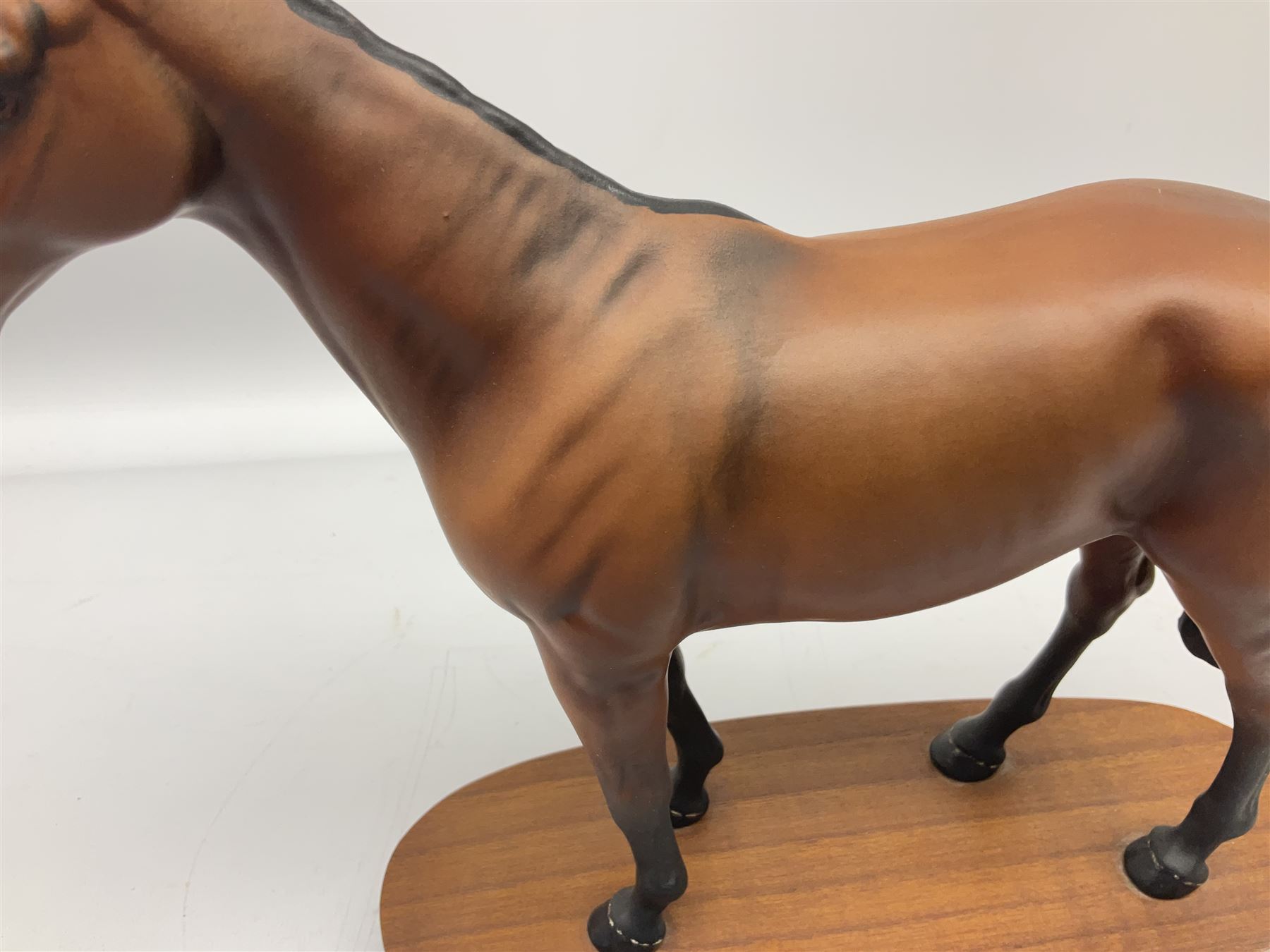 Beswick 'Mill Reef' horse figure, on a wooden plinth together with Beswick Ware horse figure 'Red Rum' on wood plinth, both with printed mark beneath