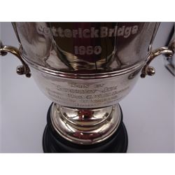 1920s silver trophy cup, of typical waisted form, with personal engraving to body and twin acanthus capped handles, hallmarked Adie Brothers Ltd, Birmingham 1924, upon black Bakelite type base, including base and handles H26cm