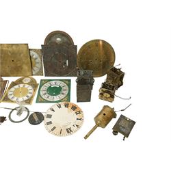 An 8-day longcase clock movement with a painted dial and various 8-day and 30-hour long case movements, dials, parts, plates, chains, and two lead weights, sold as incomplete for parts and restoration projects. 