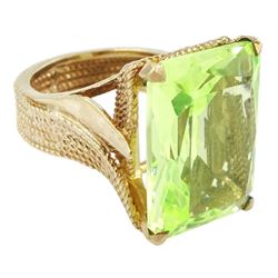 Gold large green stone set dress ring, with twist rope design shank, stamped 9ct